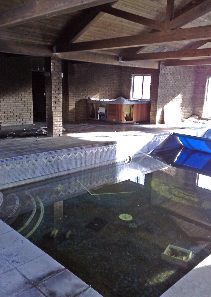 The swimming pool and Jacuzzzi at the abandoned and derelict mansion of &pound;9.4m lottery lout Michael Carroll. The house set in vast grounds is in a terrible state with every window smashed and every room trashed with litter left in great piles. Seemes Mikey really is a Pikey after all! Picture taken in March 2008.